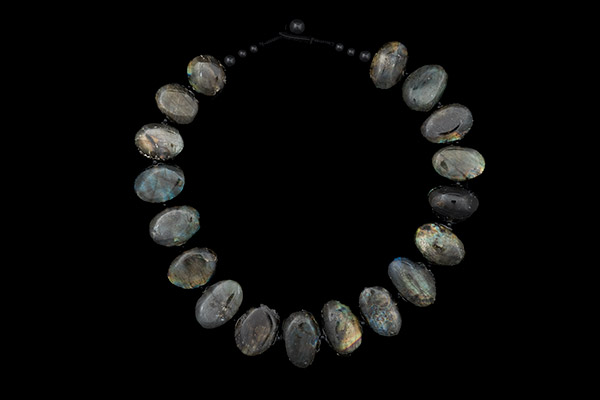 A Necklace Of Eighteen Madagascar Labradorite Oval Beads With Black Onyx Small Round Spacers