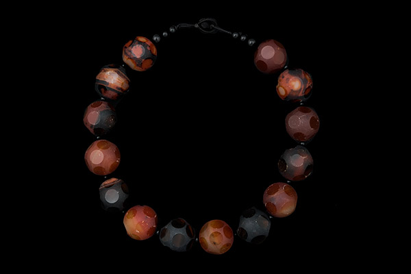 A Necklace Of Orange And Dark Brown Cornelian Round Matt Beads, Each Decorated With Polished Discs