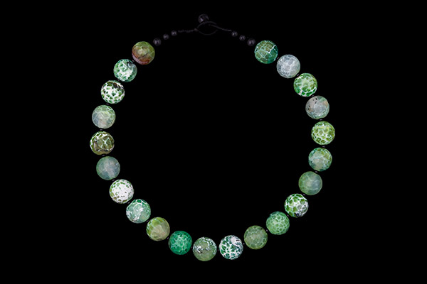 A Necklace Of Twenty-Two Green Dyed Agate Facetted Round Beads With Black Onyx Round Spacers