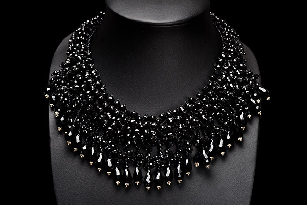 A Wide Band Necklace Of Black Facetted Glass Beads With A Fringe Of Black Facetted Glass Teardrops