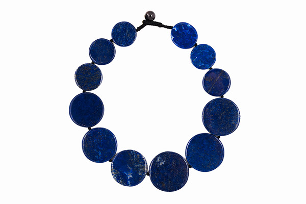 A Black Cotton Knotted Necklace With Twelve Lapis Lazuli Graduated Circular Discs