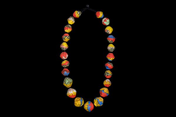 A Long Knotted Necklace Of Twenty-Three Javanese Multicoloured Patterned Ridged Glass Beads