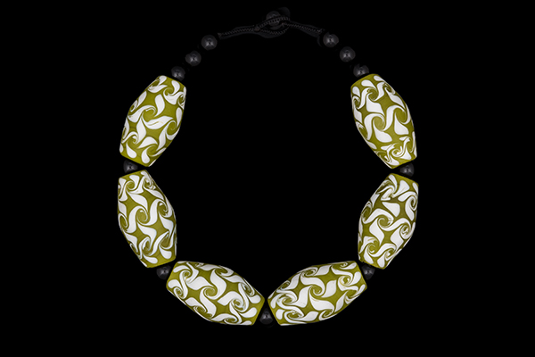 A Necklace Of Six Large Javanese Lime Green And White Floral Patterned Oval Glass Beads