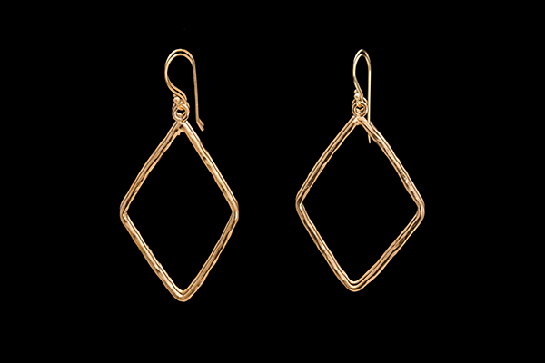 A Pair Of Large Gold Plated Earrings Each Of A Diamond Shaped Structured Band With Curved Edges