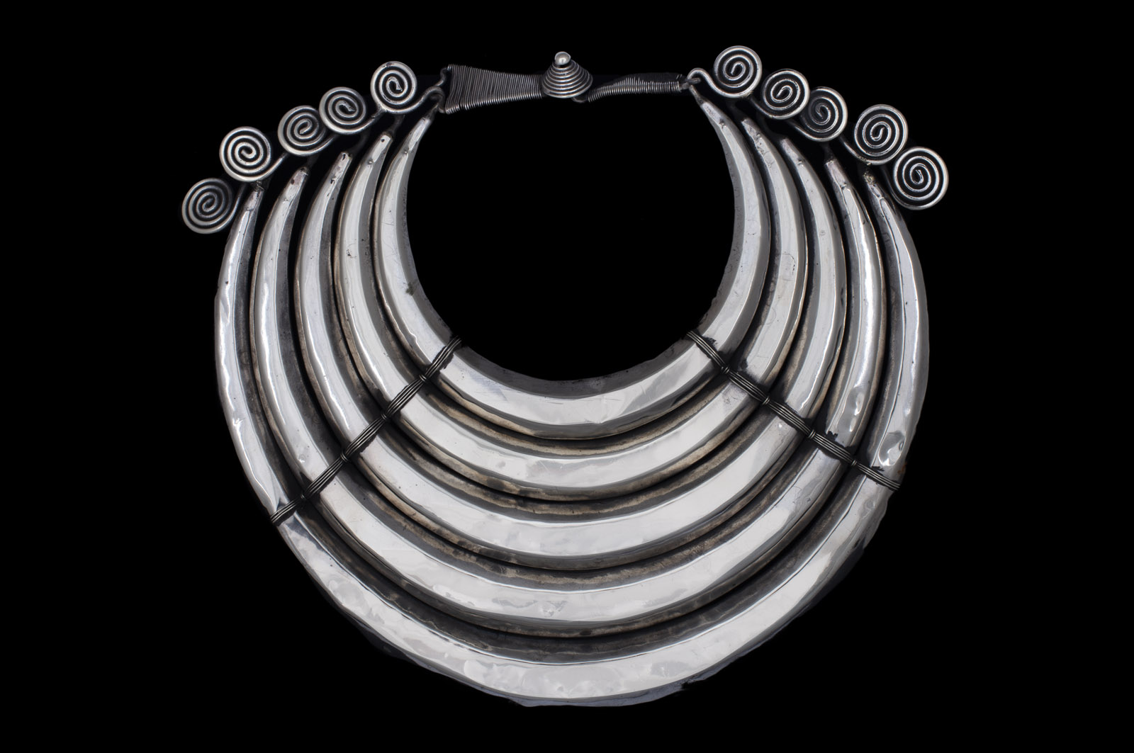 A Miao Traditional Silvered Metal Necklace Of Five Curved And Tapered Ridged Hollow Bands. China