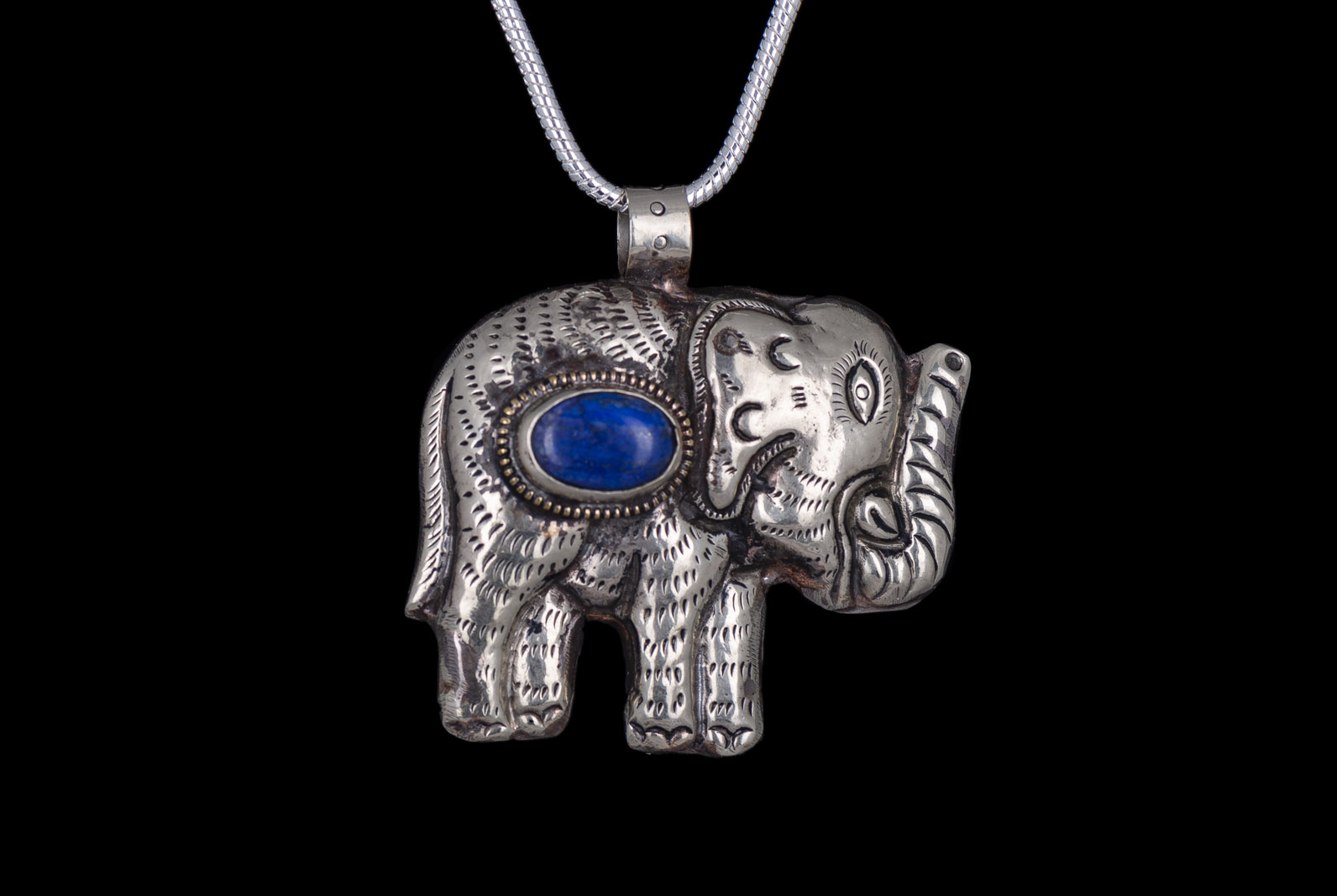 A Nepalese Silver Plated Elephant Pendant With A Lapis Lazuli Oval Inlay, On A Silvered Metal Snake Links Necklace