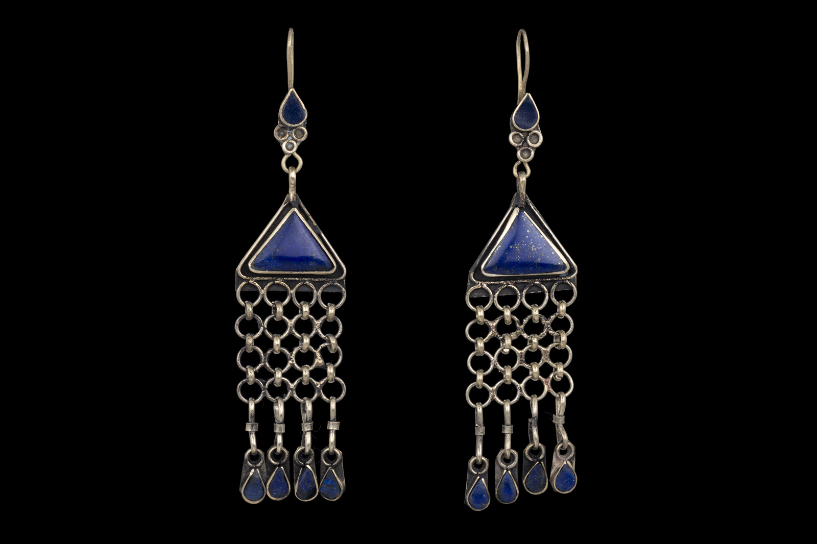 A Pair Of Afghan Silvered Plated Earrings, With Lapis Inlaid Triangular Tops And A Fringe Of Linked Silver Plated Rings With Small Lapis Pendants.