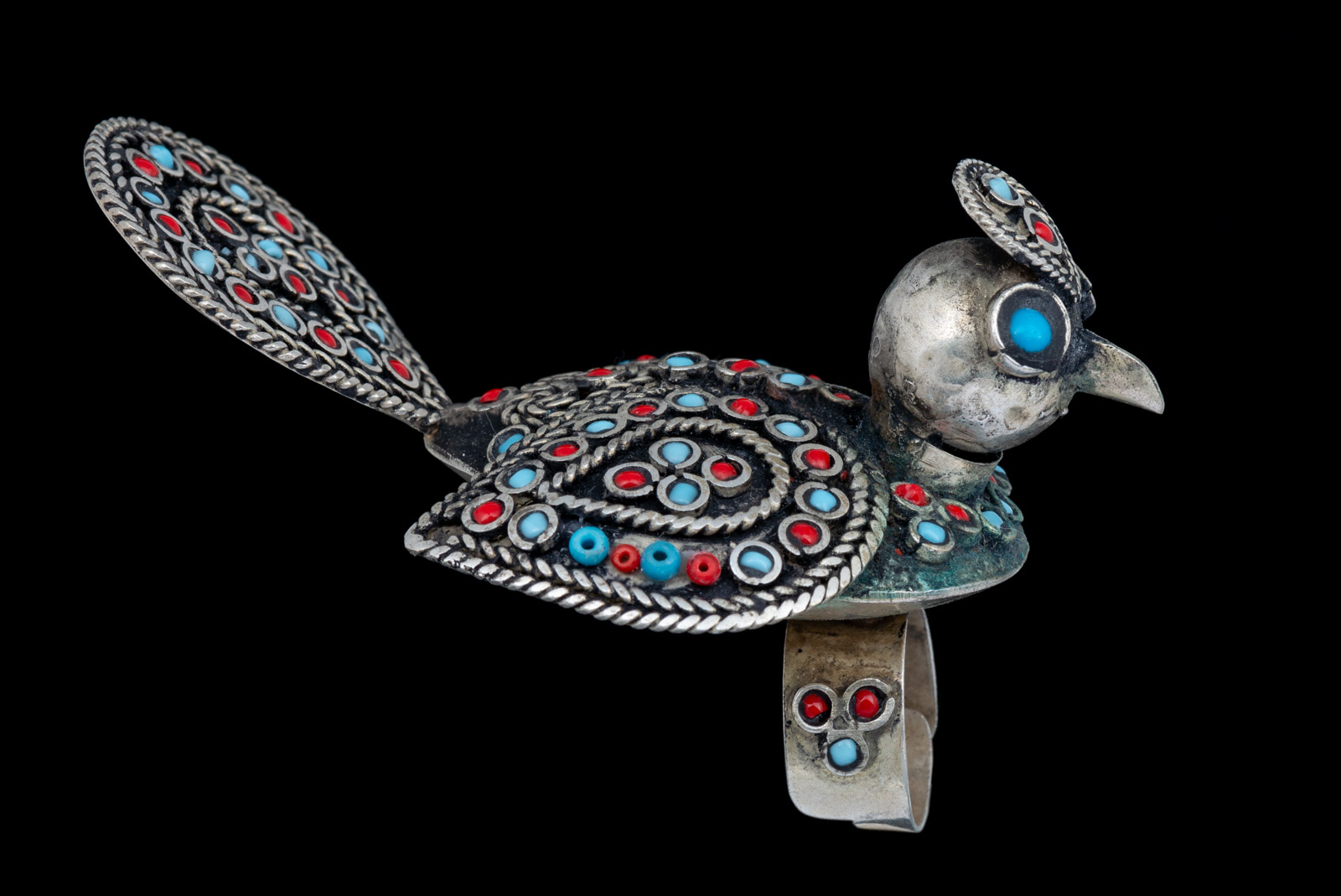 An Afghan Silvered Metal Large Bird Ring, Decorated With Red And Turquoise Small Glass Beads.