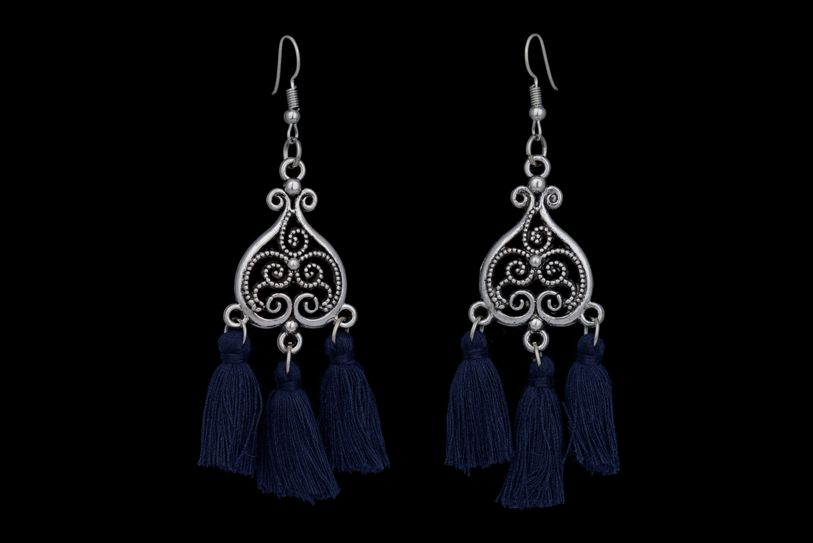 A Pair Of Silvered Metal Filigree Patterned Heart Shaped Earrings, Each With Three Pendants Of Dark Blue Silk Strands.
