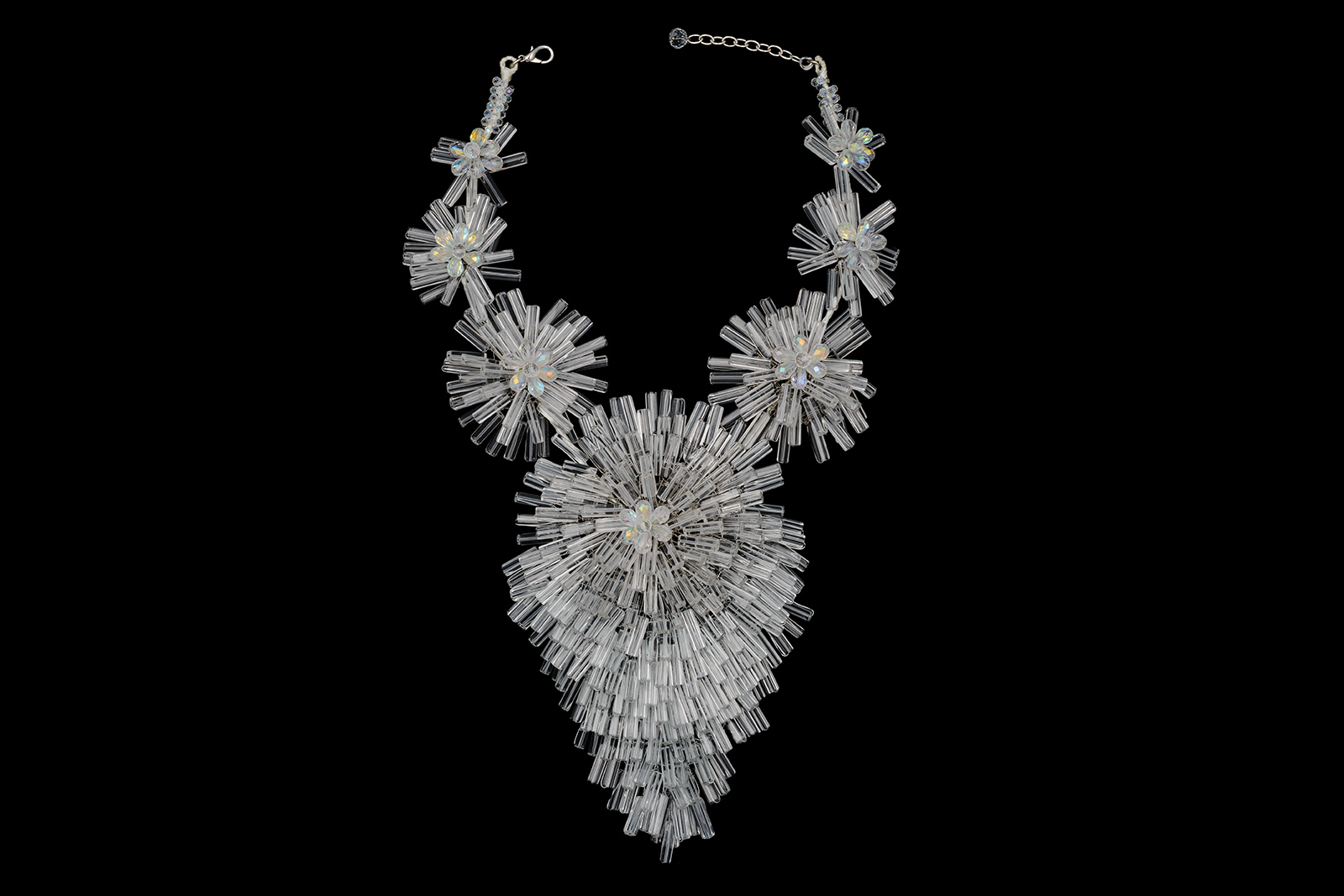 A Thai Large Necklace Of Six Clear And Opalescent Glass Graduated 'Flowers' And A Long Teardrop Shaped, Floral Patterned Pendant.