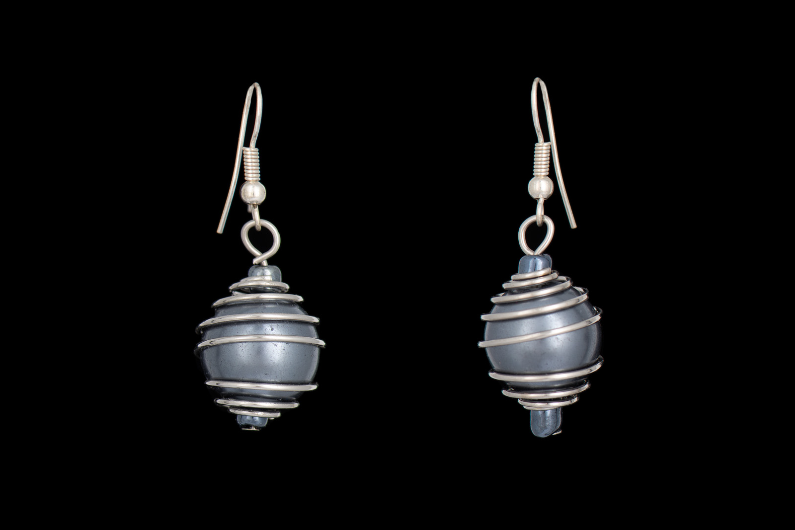 A Pair Of Silvered Grey Glass Round Beads Earrings, Decorated With Coiled Silvered Metal Wire Bands.