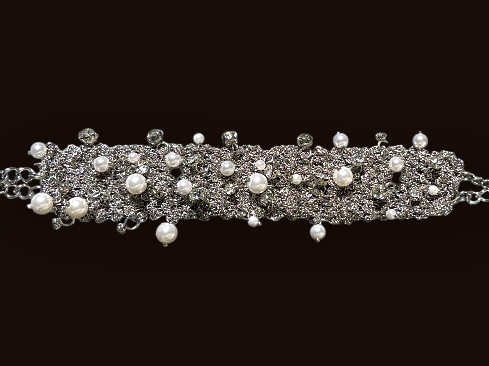 A Silvered Metal Wire Mesh Bracelet Decorated With White 'Faux Pearls' Round Glass Beads And Clear Facetted Glass Domed Circular Beads.