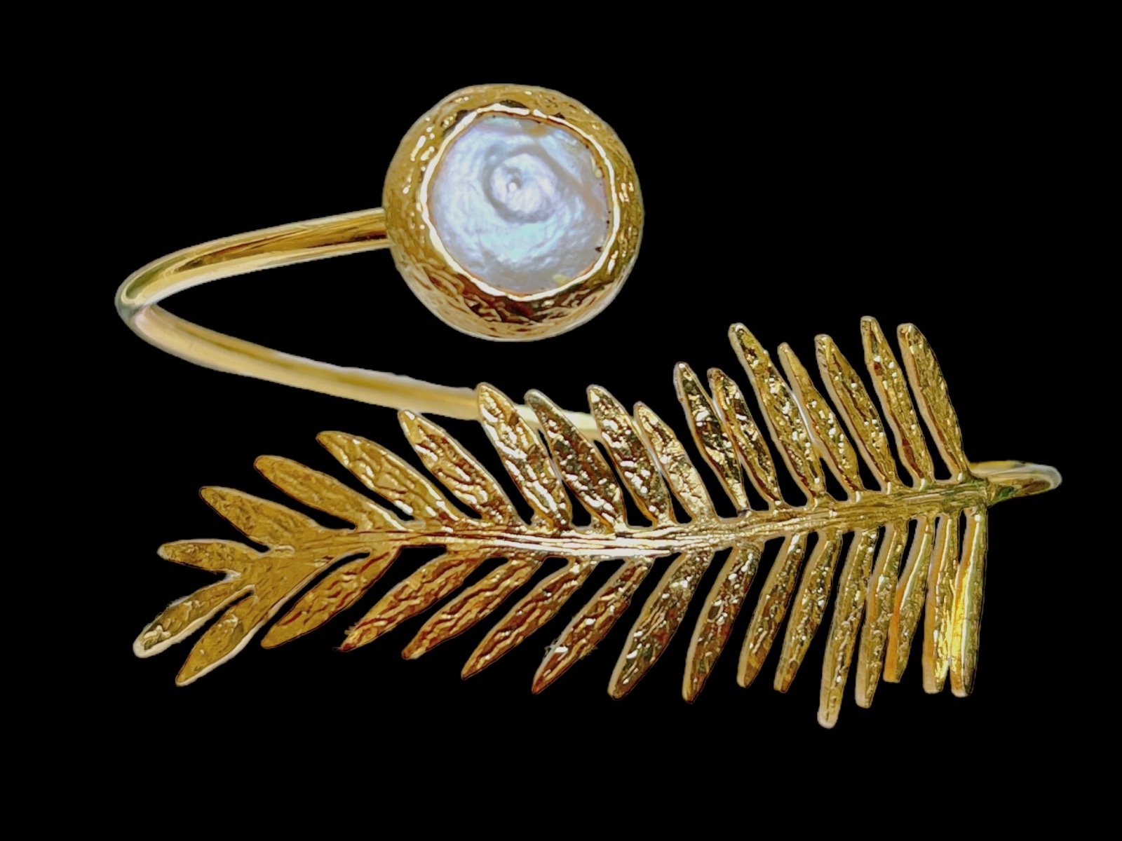 A Gold Plated Coiled Band Open Cuff Decorated With A Leaf And A White Freshwater Pearl, Set In A Gold Plated Frame.