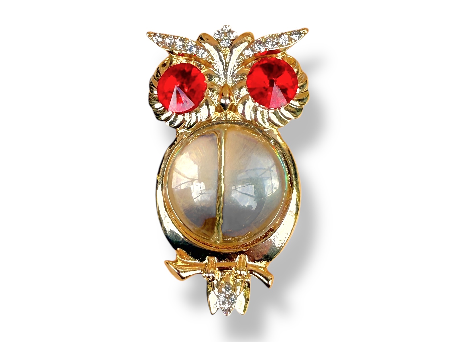 A Golden Metal Brooch Of An Owl, With A Clear Resin Domed Circular Body, And Eyes Inlaid With Red Facetted Domed Circular Beads.