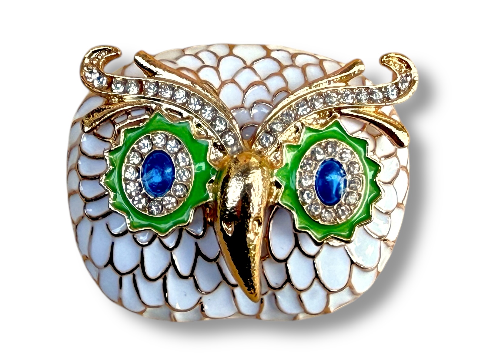 A Golden Metal Owl Head Brooch With White Enamelled Feathers, Blue And Light Green Eyes, And Small Clear Facetted Glass Inlays.