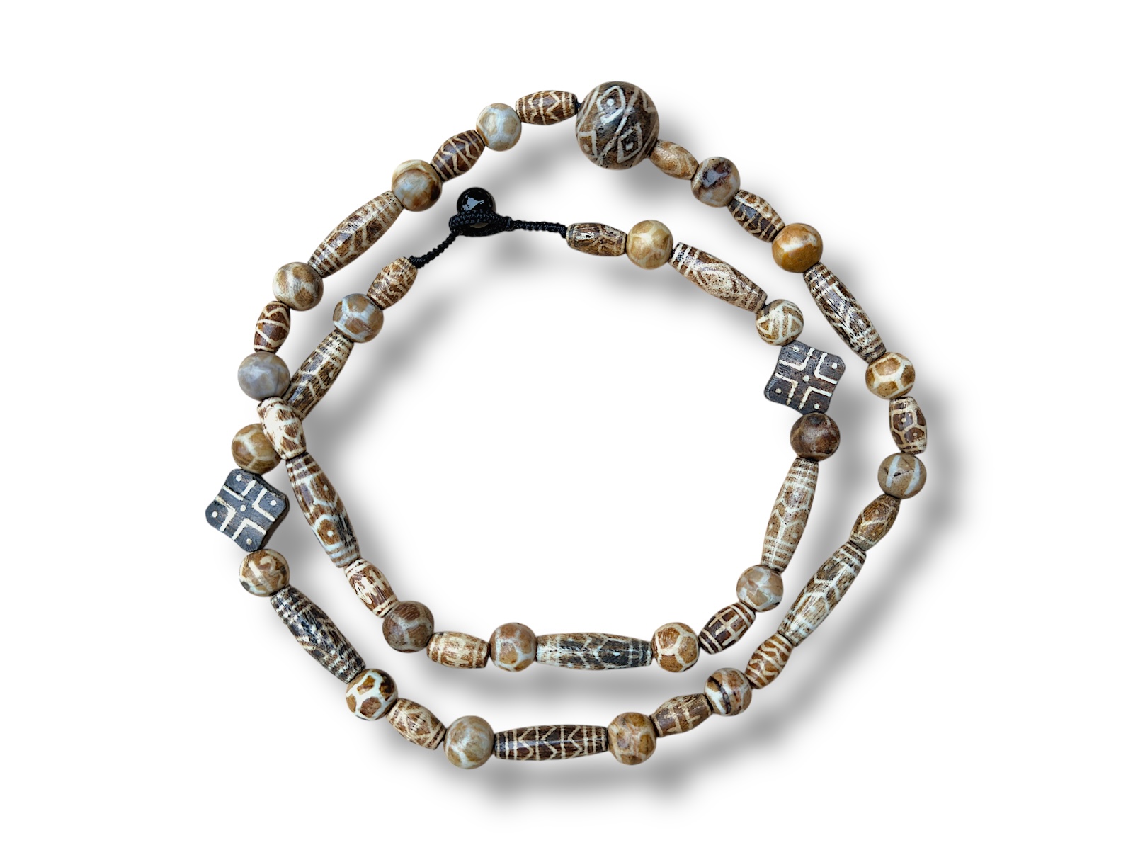 A Long Necklace Of Light Brown And Cream Coloured Patterned Resin Dzi Beads Of Mixed Shaped And Sizes.