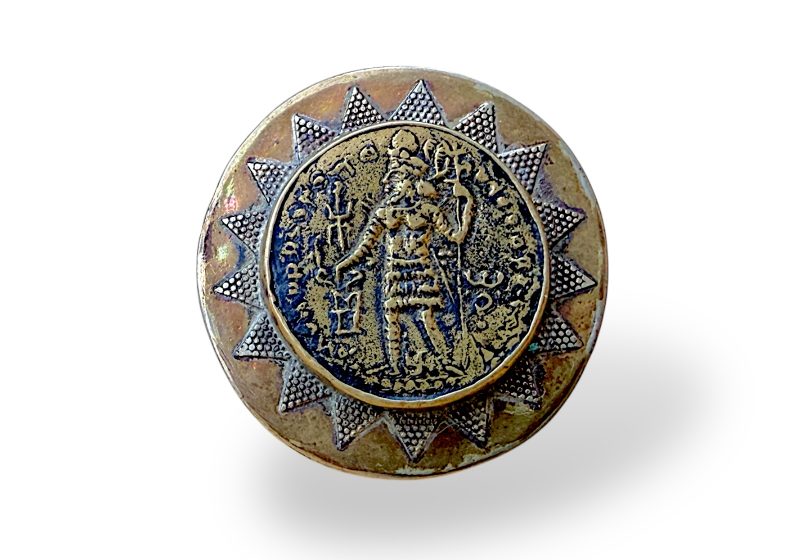 An Afghan Large Silvered Metal And Brass, Circular Top Patterned Ring Inlaid With A 'Phoenician' Brass Coin.