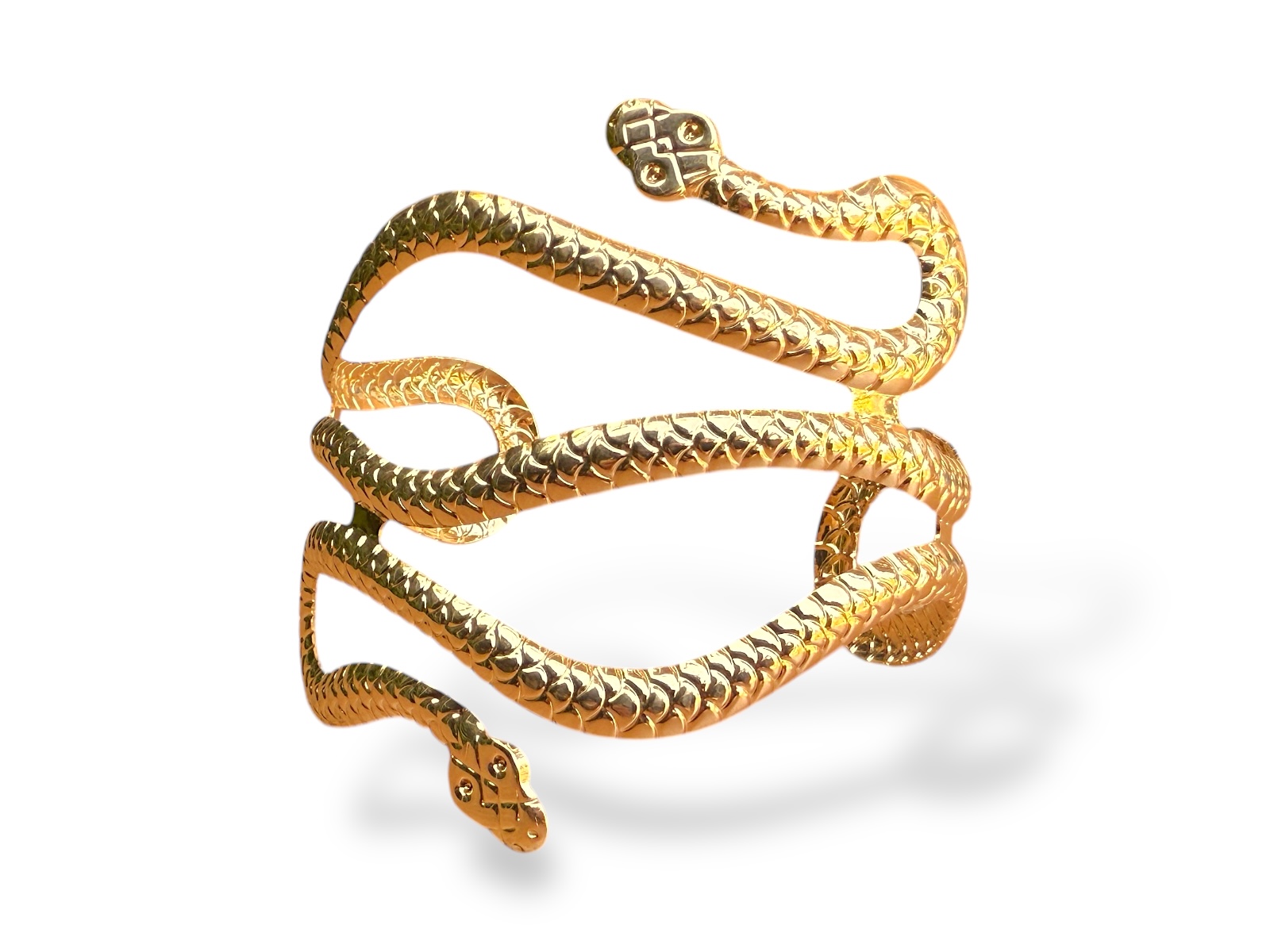 A Golden Metal Wide Armlet With A Coiled 'Scales'Patterned Band Of A Snake With Two Patterned Snake Head Finials.
