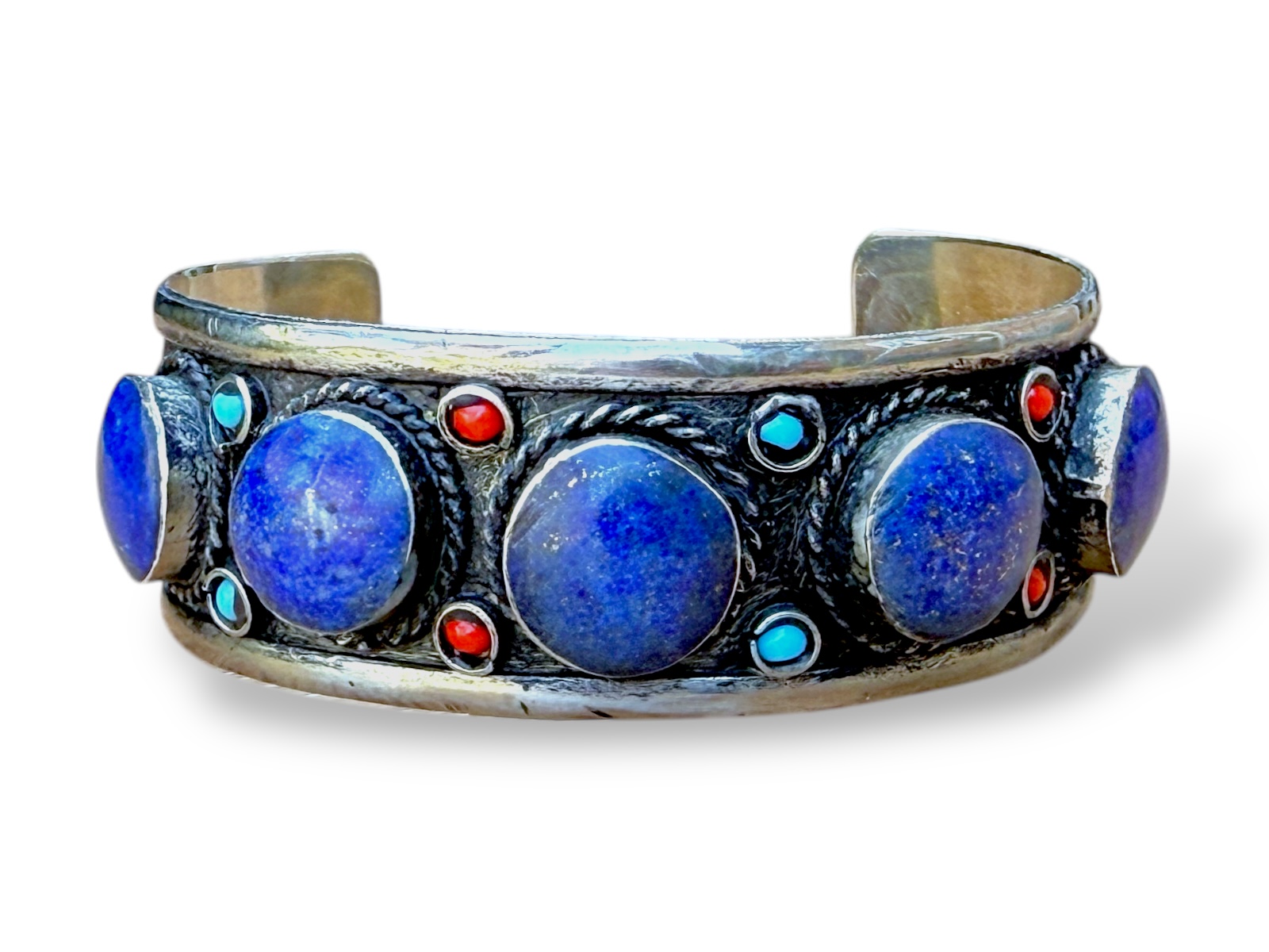 An Afghan Silver Plated Open Cuff, Inlaid With Lapis Lazuli Domed Circular Beads And Small Round Red And Turquoise Glass Beads.