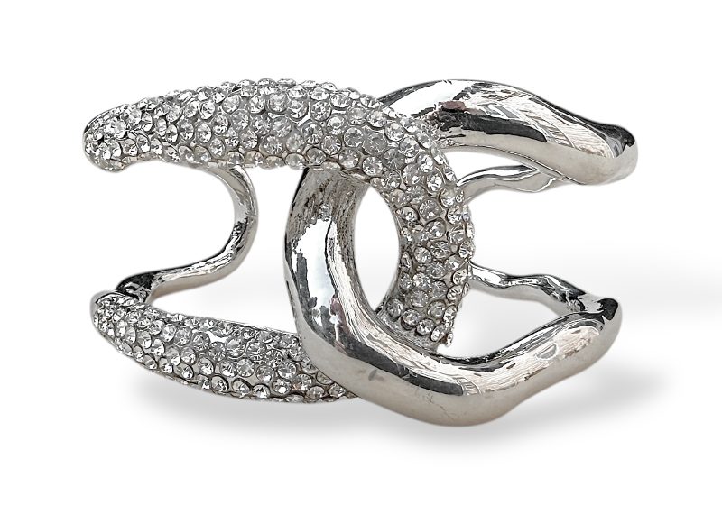 A Silvered Metal Open Cuff Of Two Linked Wavy Bands, One Band Decorated With Lines Of Small Facetted Clear Glass Beads.