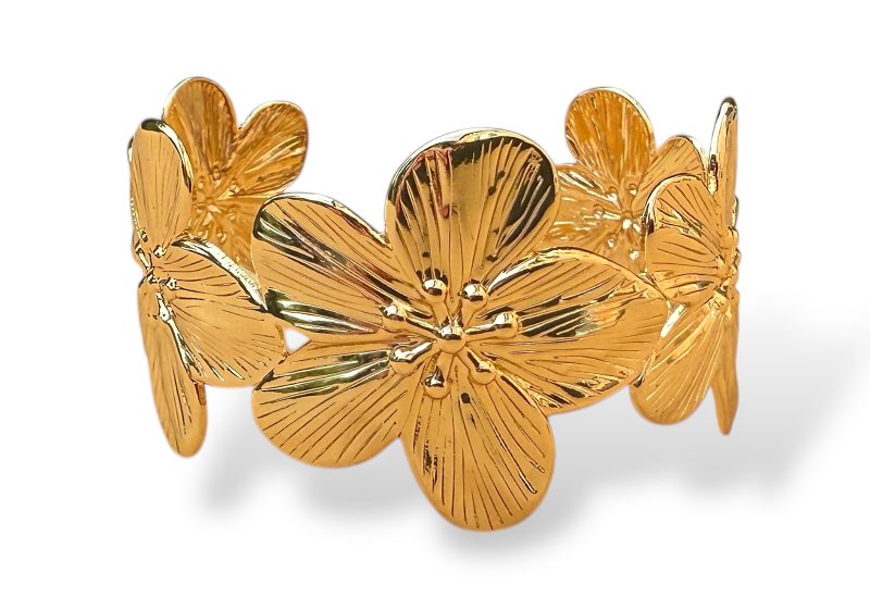 A Golden Metal Open Cuff With Five Graduated Sized Flower Panels, Each With Five Grooved Patterned Petals.