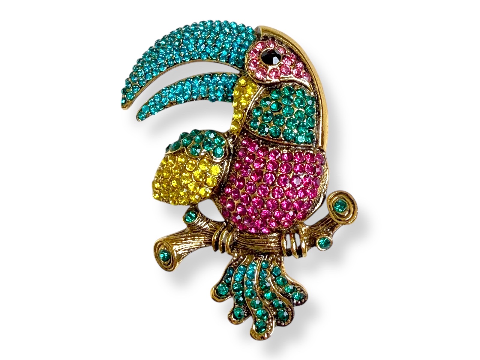 A Golden Metal Toucan Brooch Inlaid With Pink, Turquoise, Green And Yellow Small Facetted Glass Cabochons.