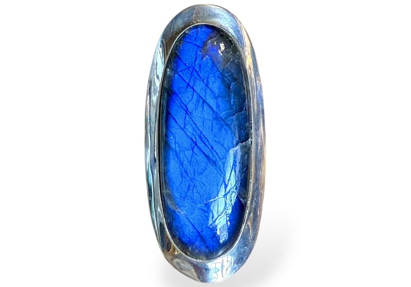 A Silver Ring With A Long Oval Top, And A Long Domed Oval Madagascar Labradorite Cabochon,  Set In A Raised Silver Frame.