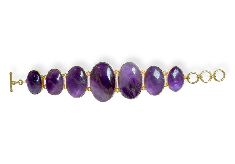 A Gold Plated Bracelet With Oval Shaped Linked Panels, Each Inlaid With An Amethyst Cabochon.