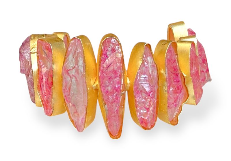 A Gold Plated Open Cuff Decorated With Eleven Pink Electroplated Crystals, Each Set In A Gold Plated Frame.