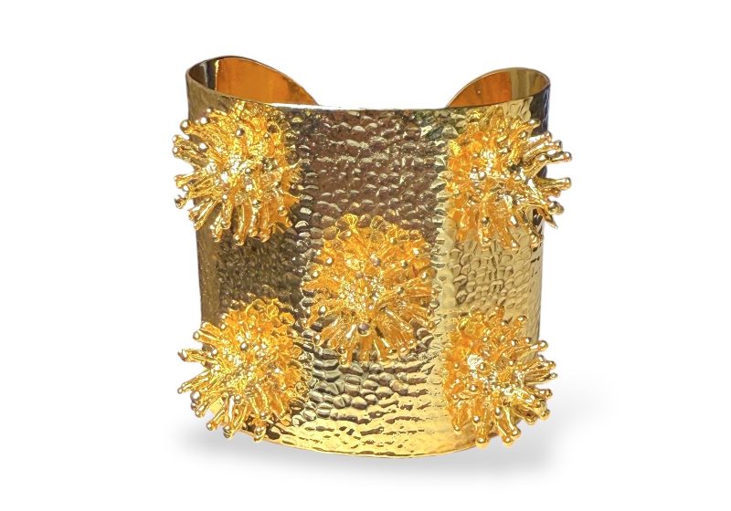 A Golden Metal, Hammered Surface, Open Cuff With Five Circular Clusters Of Thin Vertical Bands With Small Round Bead Finials.