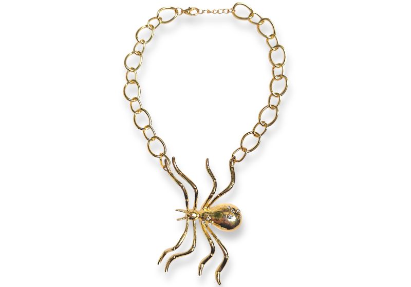 A Golden Metal Chain Necklace With A Large Golden Metal Spider Pendant.