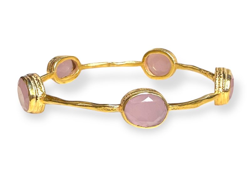 A Gold Plated Narrow Band Bangle, Decorated With Five Rose Quartz Facetted Oval Cabochons.
