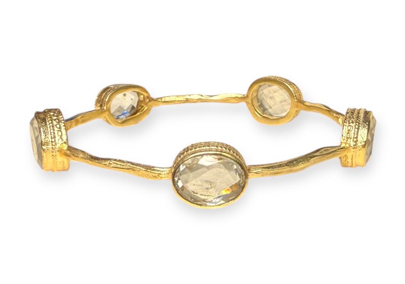 A Gold Plated Narrow Band Bangle, Decorated With Five Clear Rock Crystal Facetted Oval Cabochons.