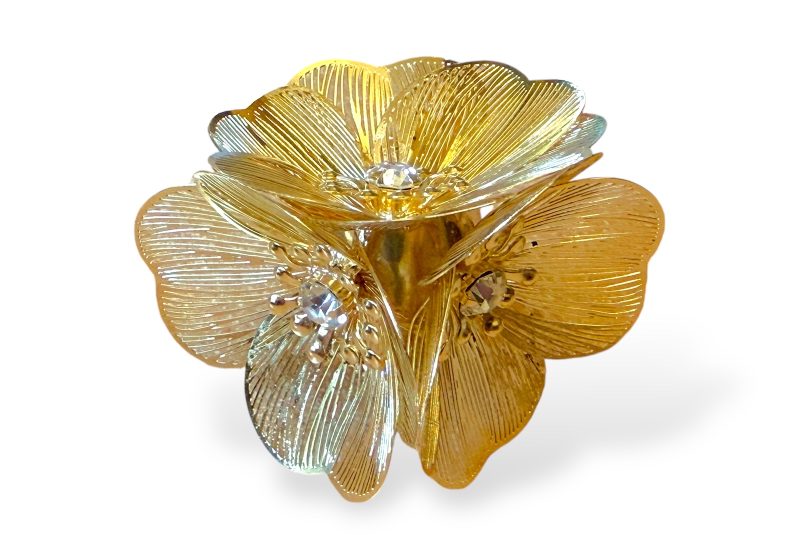 A Golden Metal Ring, With Three Flowers Of Golden Metal Wires, And Clear Facetted Glass Bead Centres.