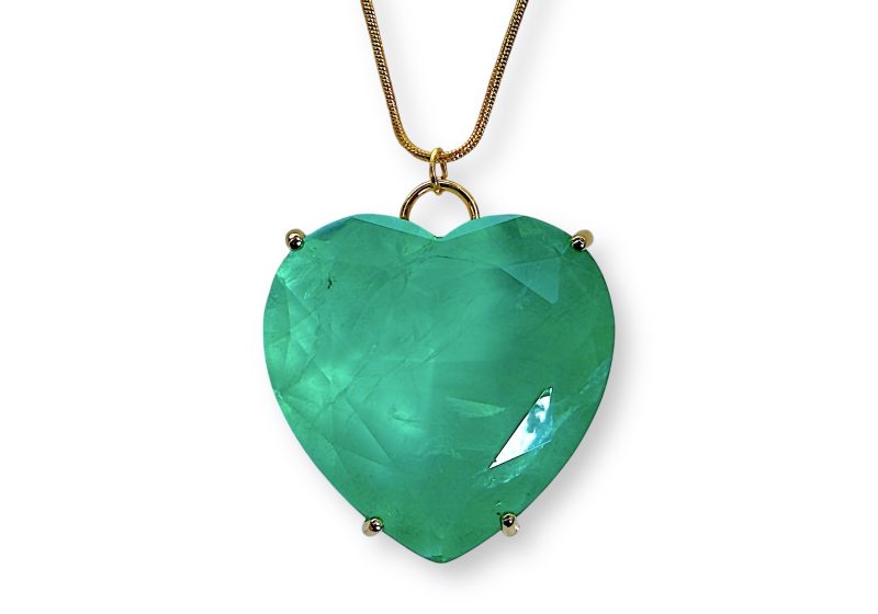 A Green Electroplated Rock Crystal Facetted Heart Shaped Pendant On A Gold Plated Chain Necklace.