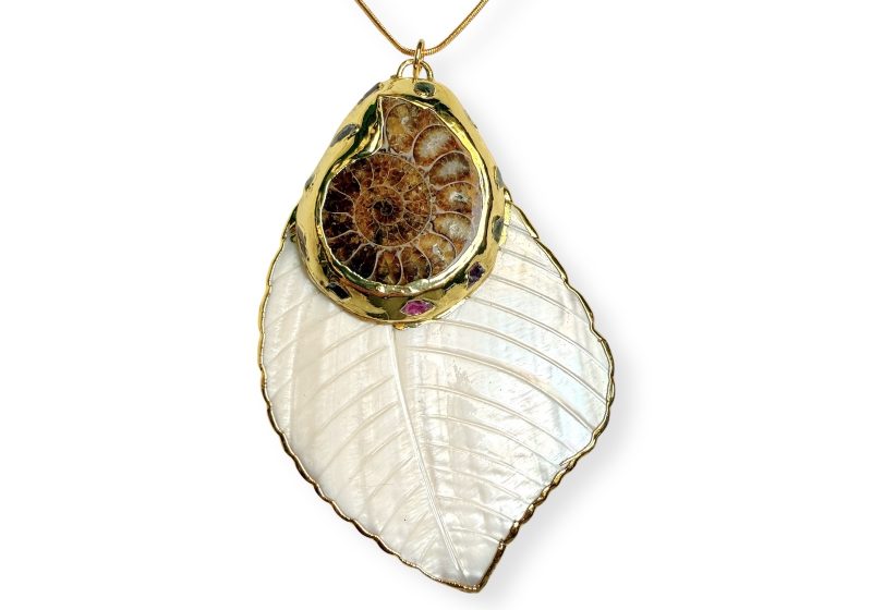 A Mother-Of-Pearl Large Shell Leaf Pendant, With An Ammonite Fossil Set In Gold Plated Borders.