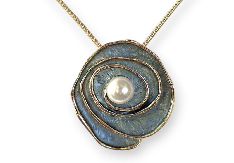 A Golden Metal Blue Enamelled Flower Pendant With A Round White Faux Pearl Centre, On A Golden Metal Braided Chain Necklace.