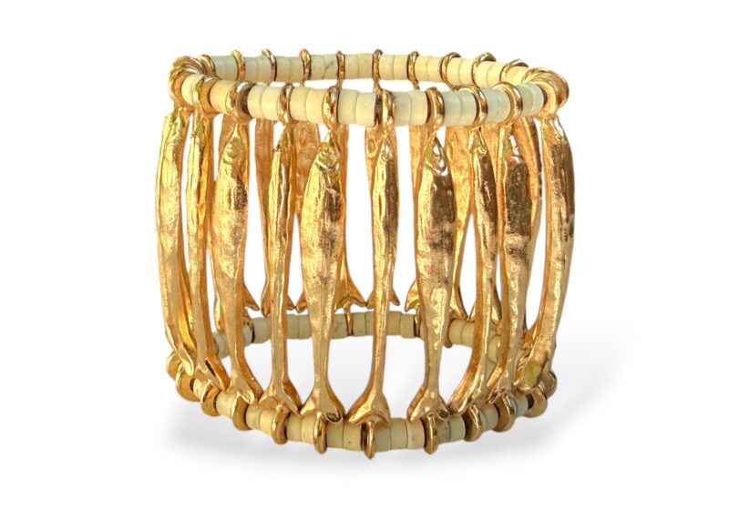 One Elasticated Bracelet With Twenty-Four Golden Metal Long Narrow Patterned Fish Panels And Cream Glass Tubular Beads.