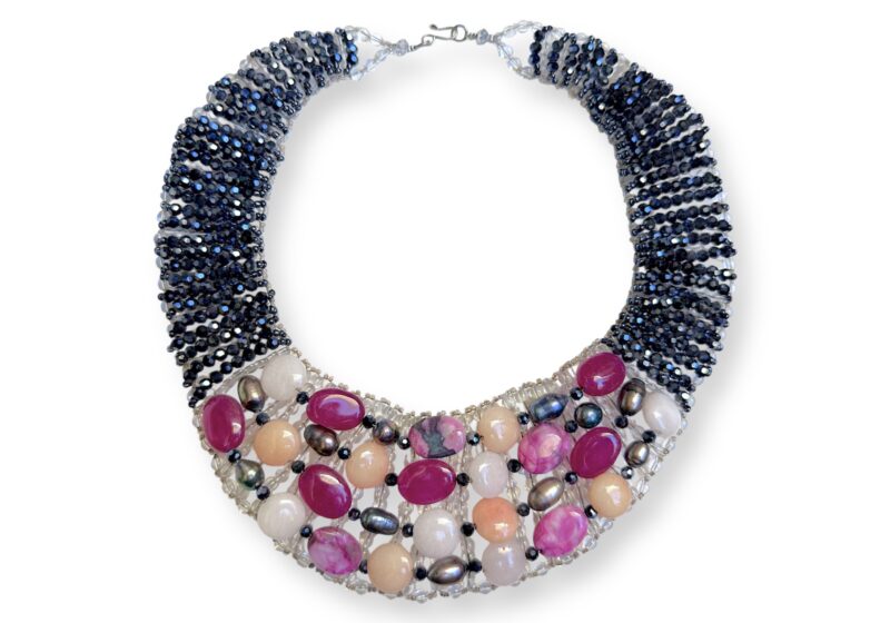 A Thai Curved Tapered Band Necklace With Black Facetted Glass Beads And Mixed Coloured And Shaped Domed Glass Beads.