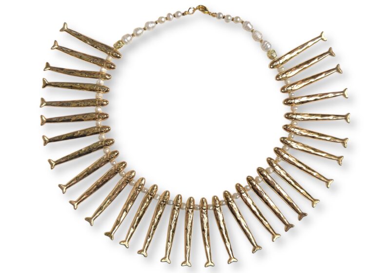 A Necklace Of Thirty-One Golden Metal Long And Narrow Patterned Fish Drops, And White Freshwater Pearl Beads And Spacers.