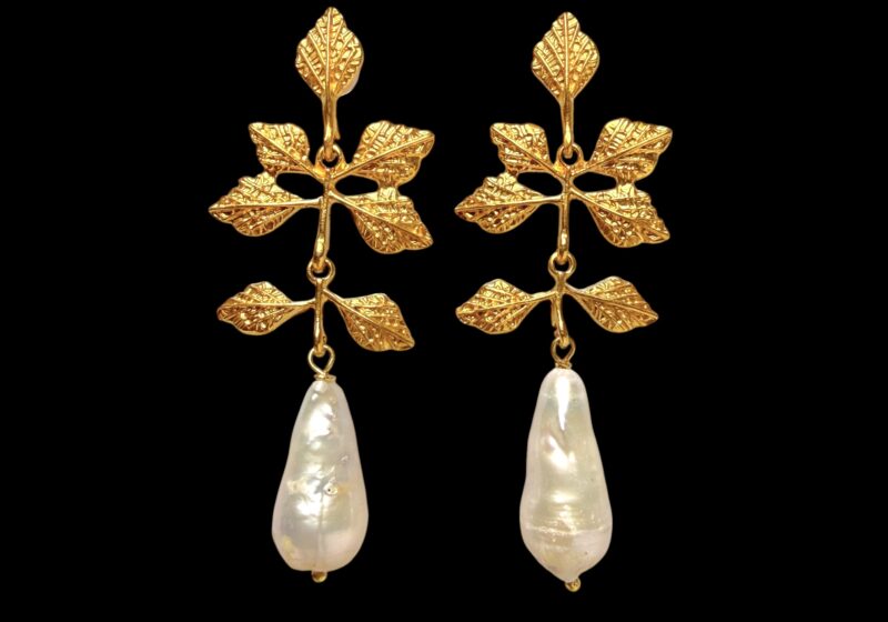 A Pair Of Gold Plated Earrings, Each With Seven Patterned Leaves And A White Baroque Freshwater Pearl Long Pendant.