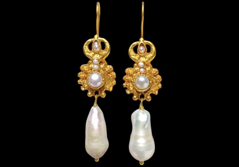 A Pair Of Gold Plated Earrings, With A White Baroque Freshwater Pearl Pendant, And Two Circular Panels Inlaid With White Freshwater Pearls.