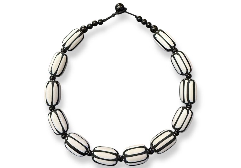 A Necklace Of Twelve White Glass Chevron Barrel Beads With Black Stripes, And Small Black Onyx Round Spacers And Beads.