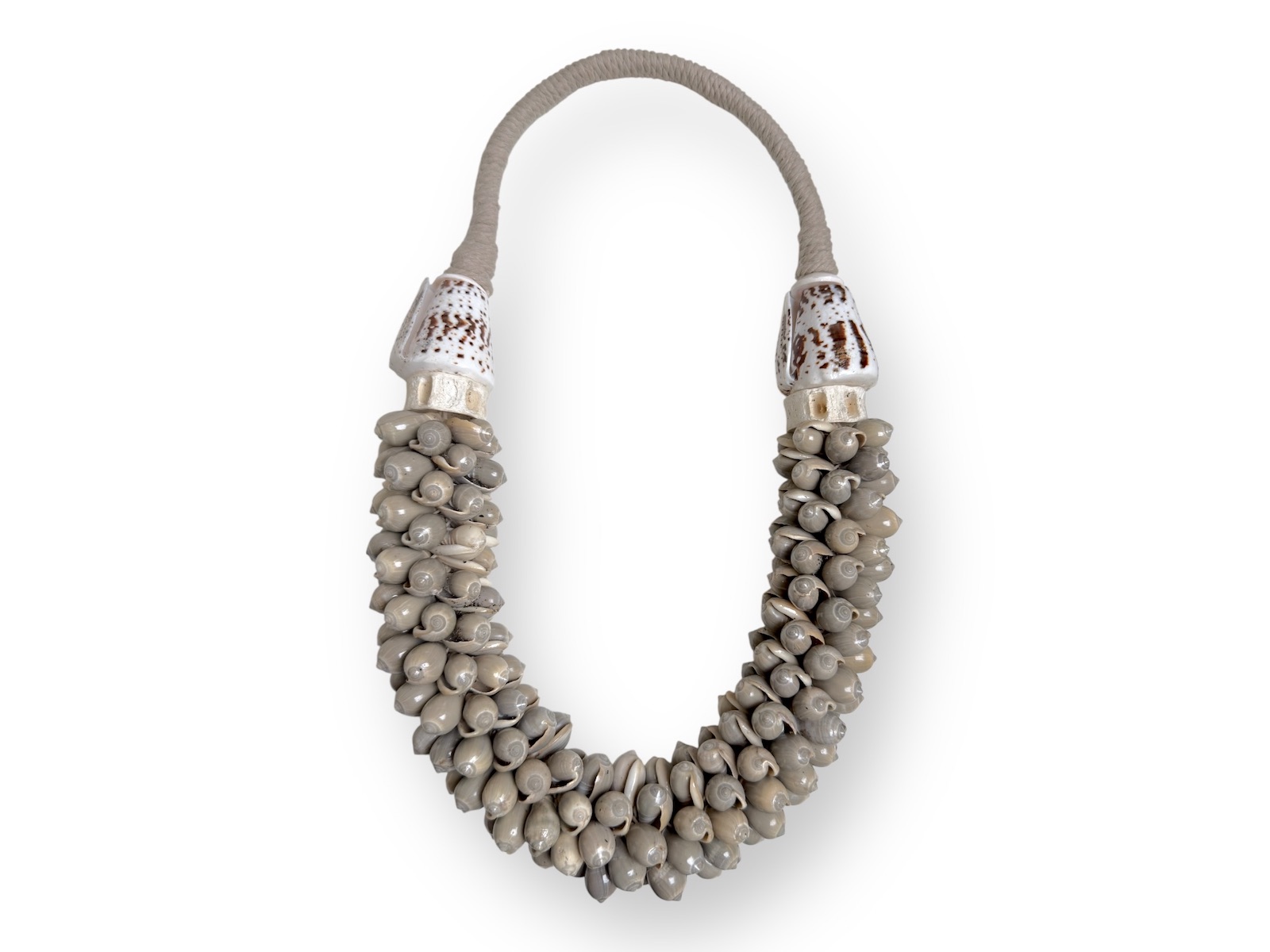 A New Guinea Long Necklace Of White Braided Rope, With Small Curled Grey Shells
