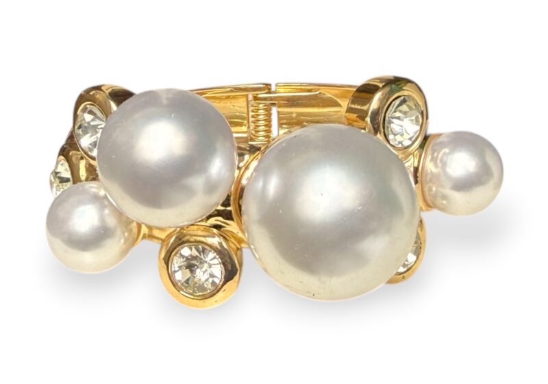 A Golden Metal Hinged Cuff With Four Round White Glass 'Faux Pearls', And Five Clear Facetted Glass Domed Circular Cabochons.