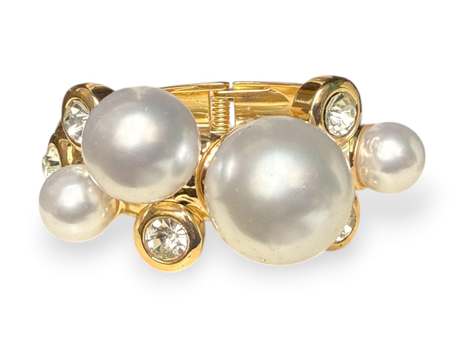 A Golden Metal Hinged Cuff With Four Round White Glass 'Faux Pearls', And Five Clear Facetted Glass Domed Circular Cabochons.