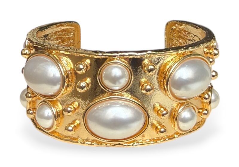 A Golden Metal Open Cuff With Small Studs And Twelve Mixed Sized And Shaped White  Glass 'Faux Pearls'.