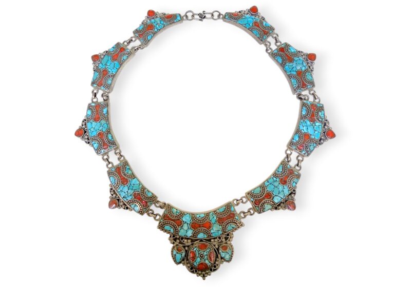 A Nepalese Silver Plated Curved Band Necklace, With Six Linked Curved Bands, Each With Turquoise And Red Glass Inlays.