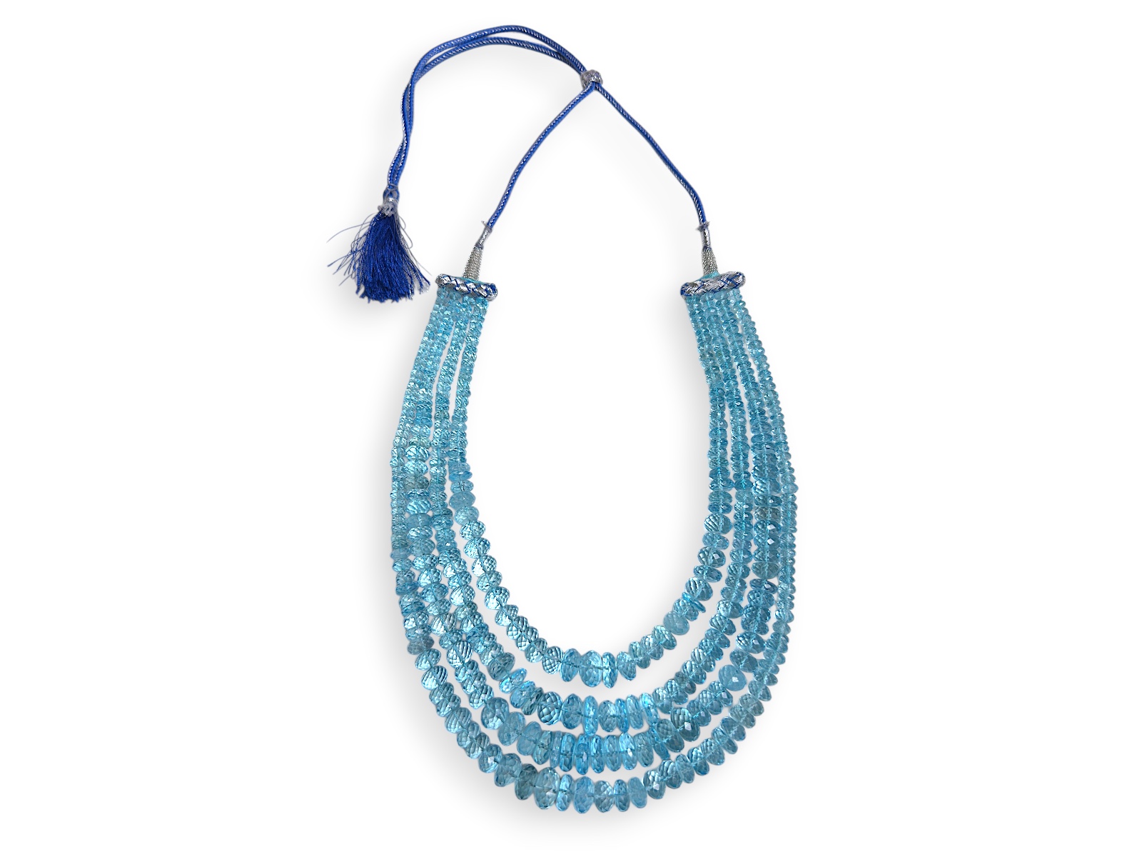 A Long Necklace With Four Graduated Strands Of Blue Topaz Small Facetted Button Beads.