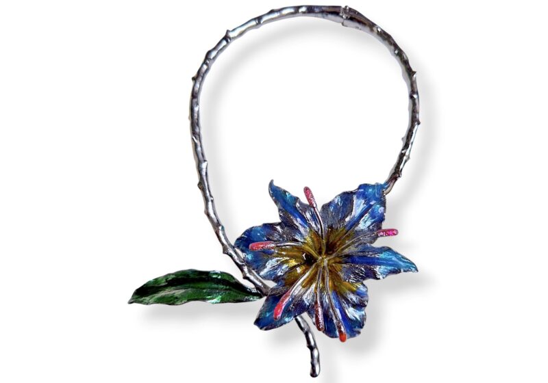 One Silvered  Metal Torque Necklace With An Enamel Painted Lily And Leaf